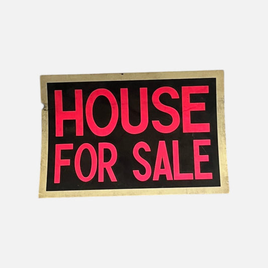 HOUSE FOR SALE sign, red letters on a black field inside an aged yellowed border with a nick in one edge, on a white background.